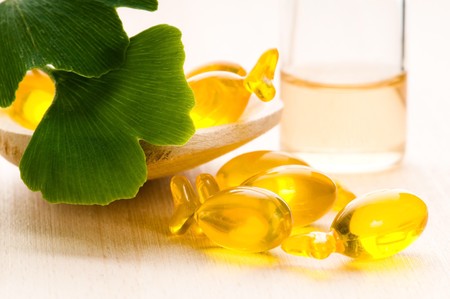ginko biloba essential oil with fresh leaves - beauty treatment の写真素材