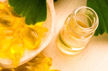 ginko biloba essential oil with fresh leaves - beauty treatment の写真素材