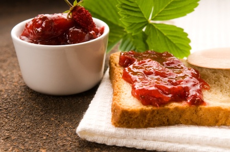 Wild strawberry jam with toastの写真素材