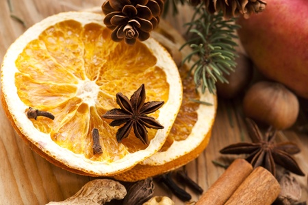Different kinds of spices, nuts and dried oranges - christmas decorationの写真素材