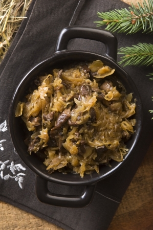 traditional polish sauerkraut (bigos) with mushrooms and plums for christmas の写真素材