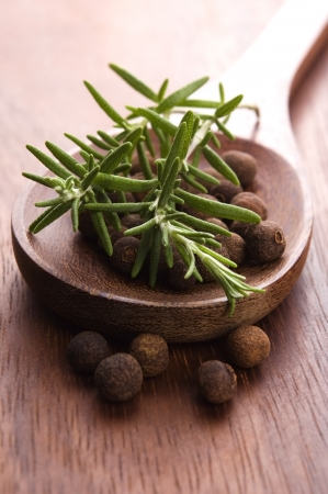 allspice with fresh rosemaryの写真素材