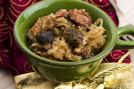 traditional polish sauerkraut (bigos) with mushrooms and plums for christmas