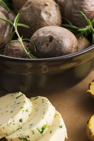 baked potatoes with herbs butterの写真素材