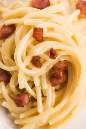 Spaghetti carbonara, a typical italian dishの写真素材