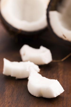 close up of a coconut on a wooden backgroundの写真素材
