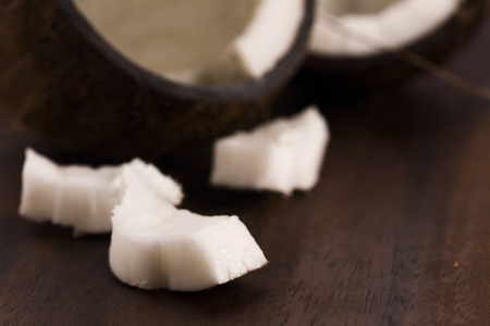 close up of a coconut on a wooden backgroundの写真素材