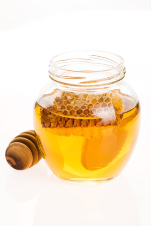 Fresh honey with honeycombの写真素材