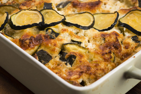 casserole with cheese and zucchini in baking dishの写真素材
