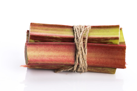 Bunch of fresh rhubarb isolated on white backgroundの写真素材