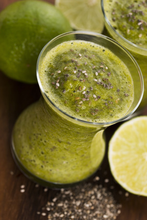 Healthy green fresh fruit and vegetable juice smoothie with chia seedsの写真素材