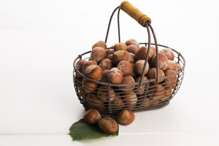 hazelnuts in basketの写真素材