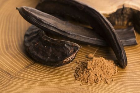 carob pods and carob powderの写真素材