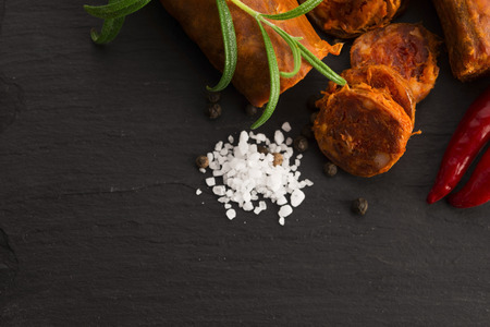 spanish traditional chorizo sausage, with fresh herbsの写真素材