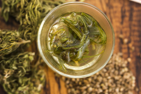 Cannabis herbal tea on wooden backgroundの写真素材