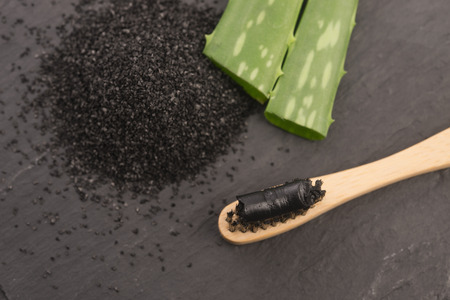 Toothbrush with black charcoal toothpaste with aloe veraの写真素材