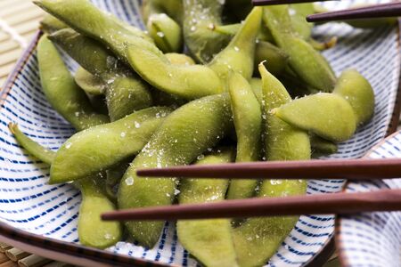 Plate of edamame at Japanese sushi restaurantの写真素材