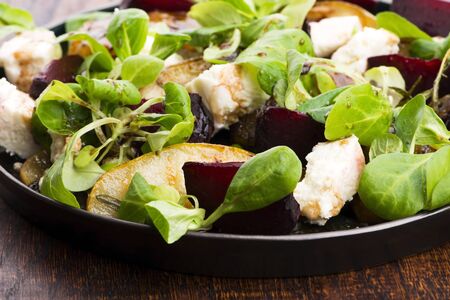 Salad of roasted beetroot, pear, lamb's lettuce, cheeseの写真素材