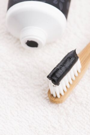 Toothbrush with black charcoal toothpasteの写真素材