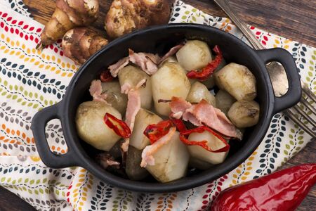 Jerusalem artichoke au gratin with ham and chili. Fricassee, fruitsの写真素材