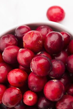 Ceramic bowl of Cranberry on white background