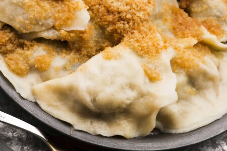 Boiled pierogi (Polish dumplings) stuffed with cabbage and mushroomsの写真素材