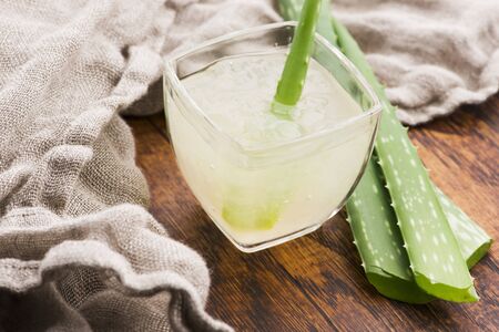 Glassware with fresh aloe vera juice and leavesの写真素材