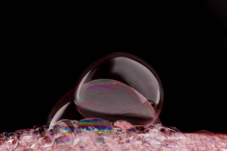 Soap foam on black backgroundの写真素材