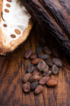 Cocoa (cacao) beans on a beanpod with focus on foreground.の写真素材