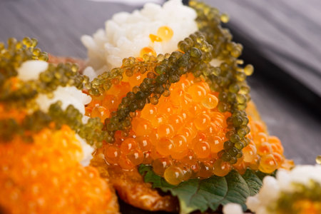 Inari sushi with caviar, rice, shiso and umibudo