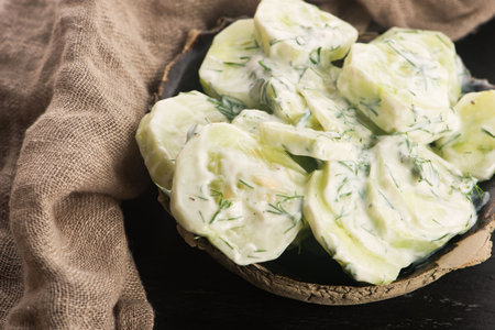 Cucumber salad with sour cream and dillの写真素材