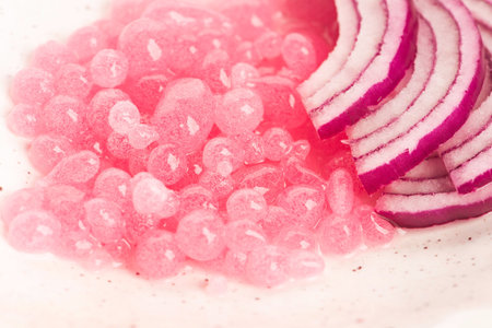 Molecular onion caviar balls on ceramics plateの写真素材