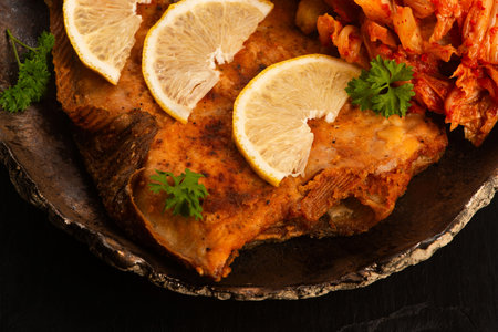 Breaded flounder with fries and kimchi