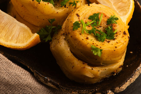 Delicious artichoke hearts beautifully seasoned and served in a rustic bowl for a healthy mealの写真素材