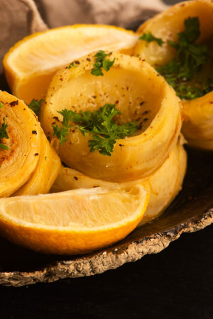 Delicious artichoke hearts beautifully seasoned and served in a rustic bowl for a healthy mealの写真素材