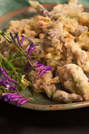 Alfalfa Flower Tempura on Handmade Ceramic Plateの写真素材