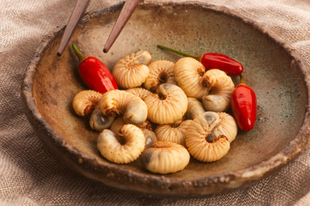 Fried mushrooms with red chili pepper in a bowlの写真素材