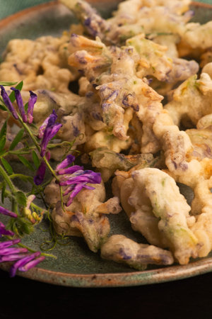 Alfalfa Flower Tempura on Handmade Ceramic Plateの写真素材