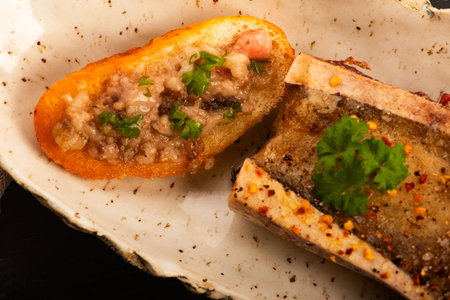 Roasted Bone Marrow with Spices and Baguette in Handmade Ceramic Bowl