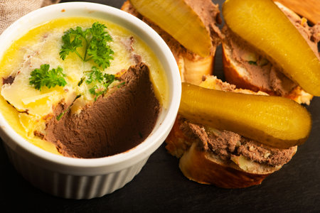 Chicken Livers with Brandy in Cocotte Served with Baguette and Pickled Cucumber