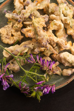 Alfalfa Flower Tempura on Handmade Ceramic Plateの写真素材