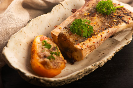 Roasted Bone Marrow with Spices and Baguette in Handmade Ceramic Bowl