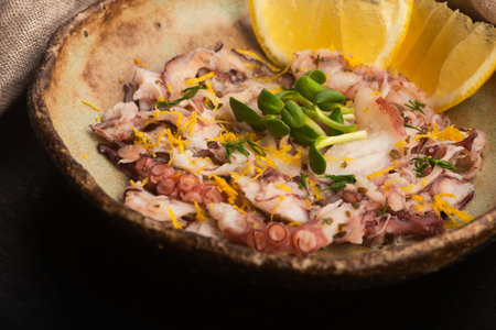 Octopus Carpaccio with Lemon in Handmade Ceramic Bowl