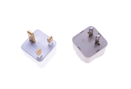 British and American plug adaptors isolated on white background