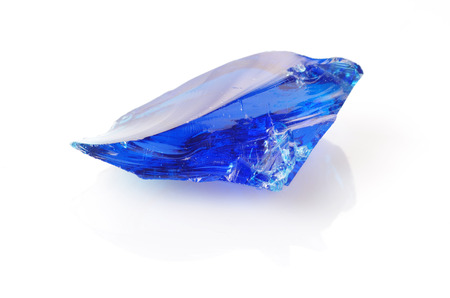 a piece of blue glass isolated on white backgroundの写真素材