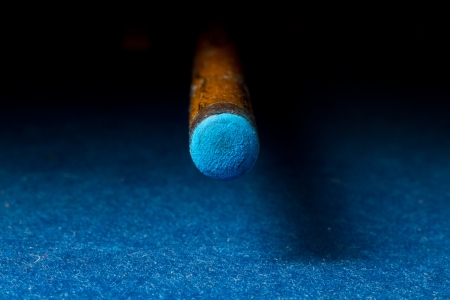 Looking down the barrel of a pool cue.の写真素材