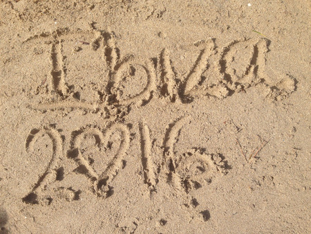 Writing in the sand of an Ibiza's beachの写真素材