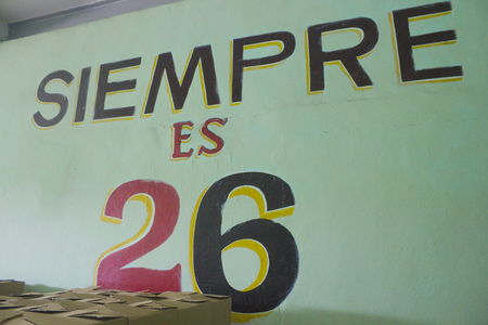 A wall with the sentence siempre es 26 - Pinar del Rio - Cubaのeditorial素材
