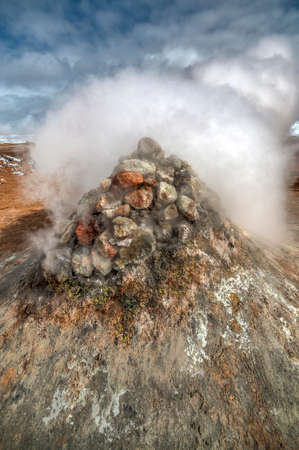 Geothermal area Namafjall Hverir, Iceland. The area around the boiling mud is multicolored and cracked.の写真素材