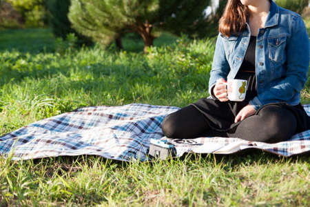 Woman seated on a parkの写真素材